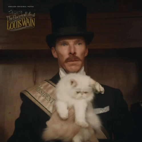 Man in Top Hat Holding Small White Cat The Electrical Life of Louis Wain