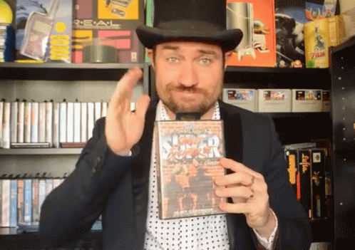 Man in Top Hat Holding Street Fighter