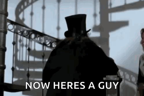 Man in Top Hat in Front of Spiral Staircase