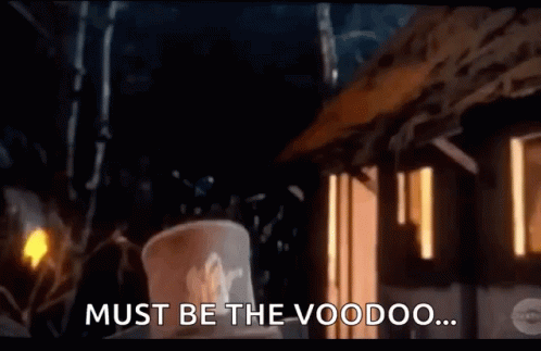 Man in Top Hat in Front of Voodoo Building