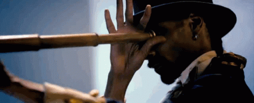 Man in Top Hat Looking Through Telescope