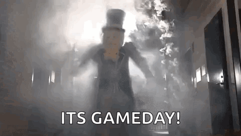 Man In Top Hat Standing In Hallway With Smoke GIF