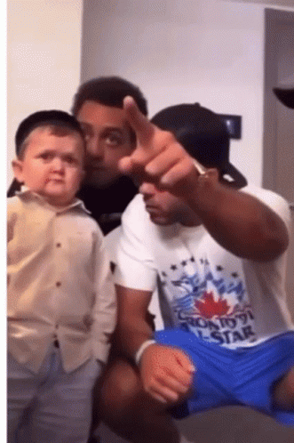 Man In Toronto Star T-Shirt Holding Baby GIF