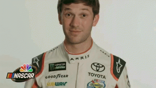 Man in Toyota Racing Suit Making a Face