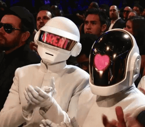 Man in Treat Helmet Next to Man in Heart Helmet