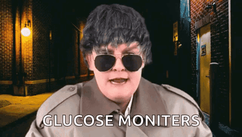 Man in Trench Coat and Sunglasses Says Glucose Monitors