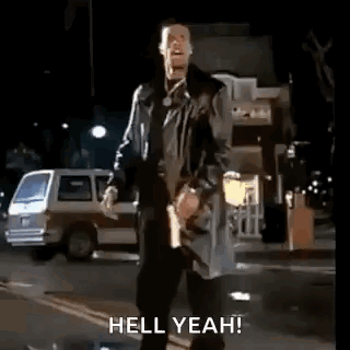 Man In Trench Coat Arms Outstretched Hell Yeah GIF