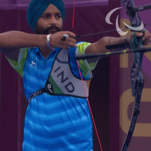 Man in Turban Holding Bow and Arrow With Ind Vest
