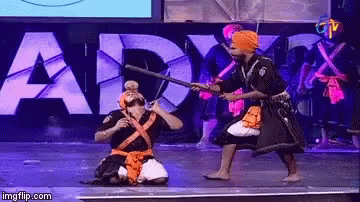 Man in Turban Holding Stick Saying Army