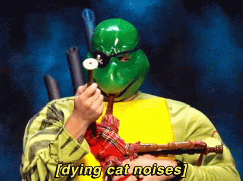 Man in Turtle Costume Playing Bagpipe Dying Cat Noises