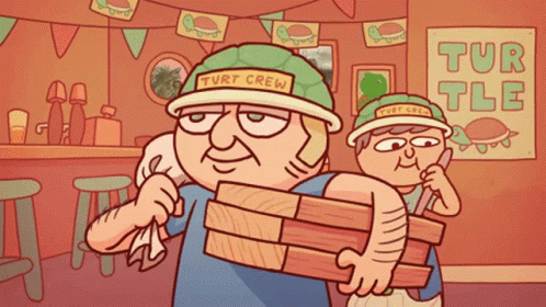 Man in Turtleneck Hat Carrying Wood