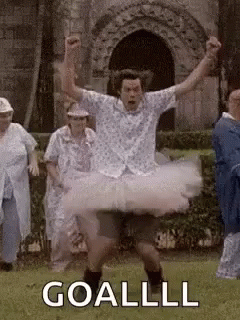 Man in Tutu Dancing in Field