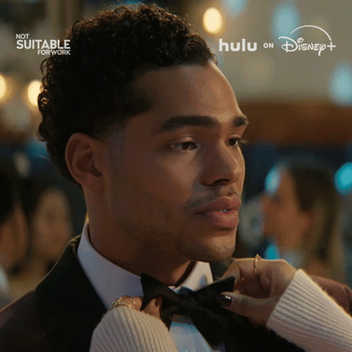 Man in Tuxedo Adjusted by Woman With Hulu on Disney