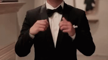 Man in Tuxedo Adjusting Jacket