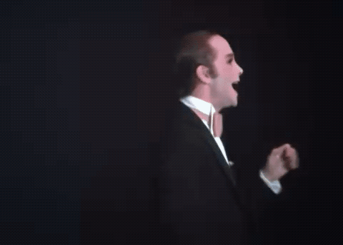 Man in Tuxedo and Bow Tie at Podium