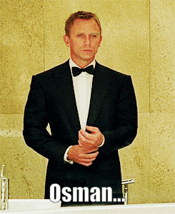 Man In Tuxedo And Bow Tie At Sink With Word Osman GIF