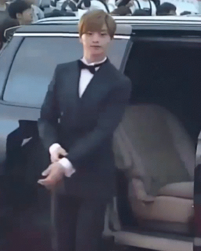 Man in Tuxedo and Bow Tie Getting Out of Car