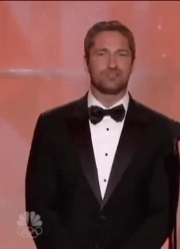 Man in Tuxedo and Bow Tie Giving Speech