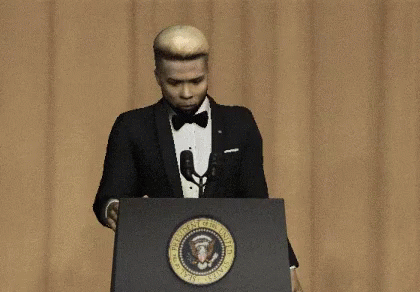 Man in Tuxedo and Bow Tie Giving Speech