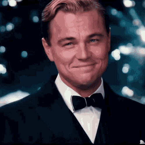 Man In Tuxedo And Bow Tie Smiling GIF