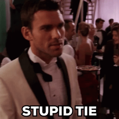 Man In Tuxedo And Bow Tie Standing GIF