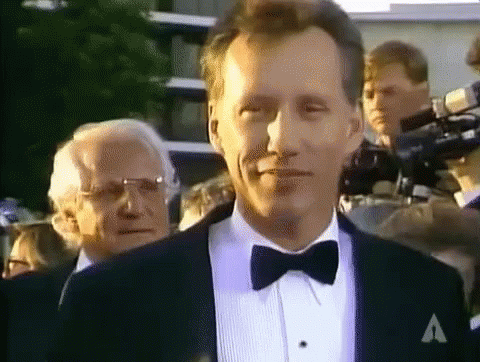 Man in Tuxedo and Bow Tie with A on Jacket