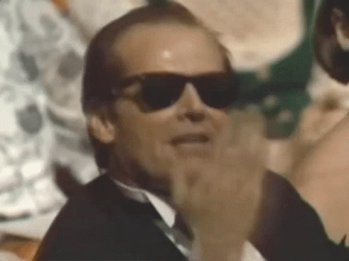 Man in Tuxedo and Sunglasses Clapping