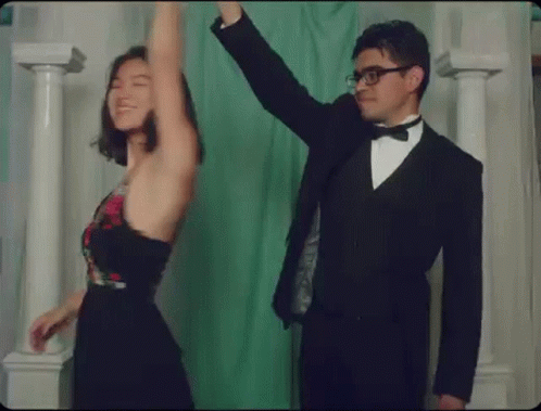 Man in Tuxedo and Woman Dancing