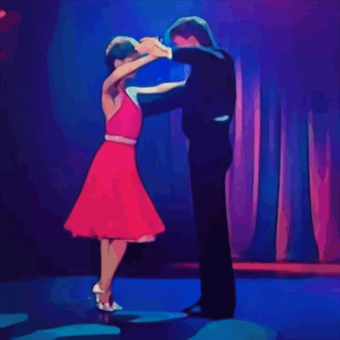 Man in Tuxedo and Woman in Red Dress Dancing