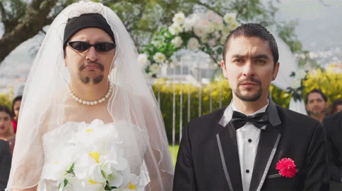 Man In Tuxedo And Woman In Veil GIF
