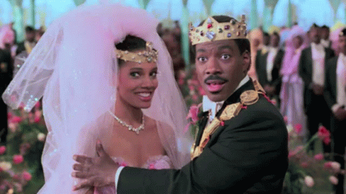 Man in Tuxedo and Woman in Wedding Dress Dancing