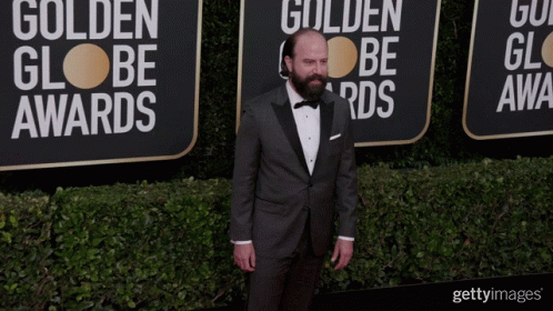 Man in Tuxedo by Golden Globe Awards Wall