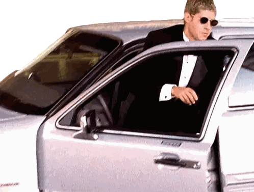 Man in Tuxedo Getting Out of Car