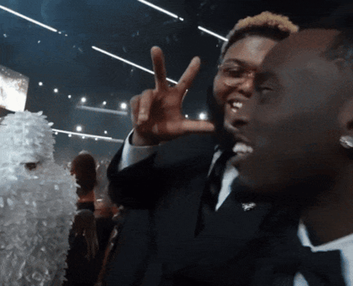 Man in Tuxedo Giving Peace Sign