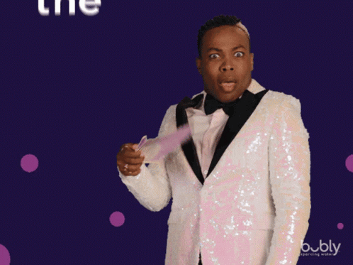 Man in Tuxedo Holding Fan Saying The Shade