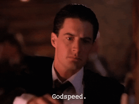 Man in Tuxedo Holding Gun