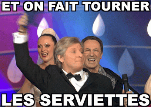 Man In Tuxedo Holding Microphone Et On Fait Tourner Les Serviettes GIF