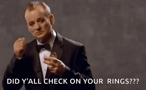 Man In Tuxedo Holding Whiskey Ring A Ding GIF