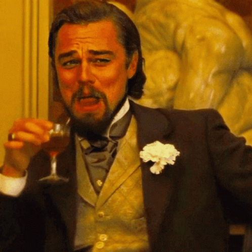 Man in Tuxedo Holding Wine