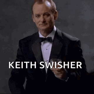 Man In Tuxedo Holding Wine Glass GIF
