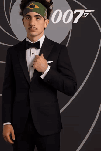 Man in Tuxedo in Front of 007 Sign