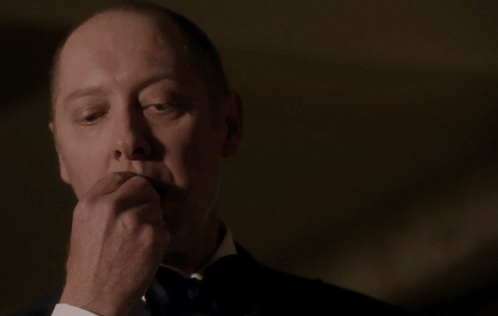 Man In Tuxedo In Front Of Red BP Sign GIF