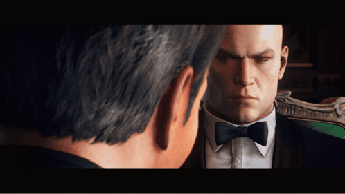 Man in Tuxedo Looking at Another Man