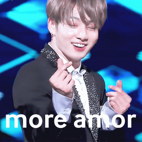 Man in Tuxedo Making Heart Fingers More Amor