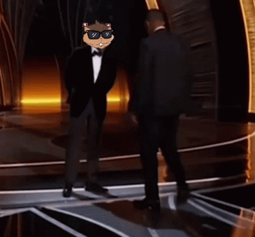 Man in Tuxedo Next to Man in Suit and Tie