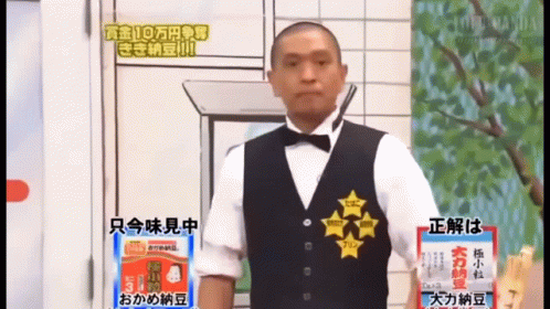 Man in Tuxedo Next to Noodles Sign
