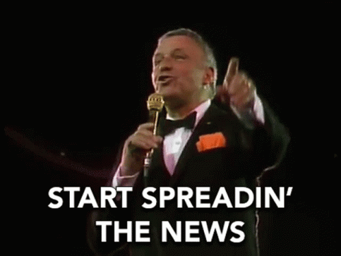 Man in Tuxedo Singing into Microphone Start Spreadin' the News