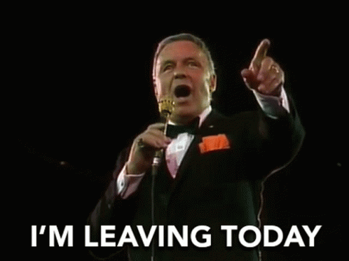 Man in Tuxedo Singing Into Microphone Start Spreadin the News