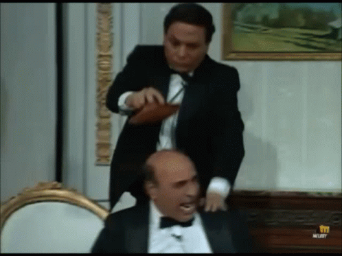 Man in Tuxedo Standing Next to Another Man