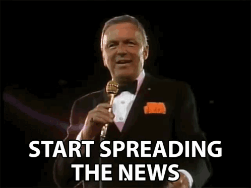 Man in Tuxedo Talking Into Microphone